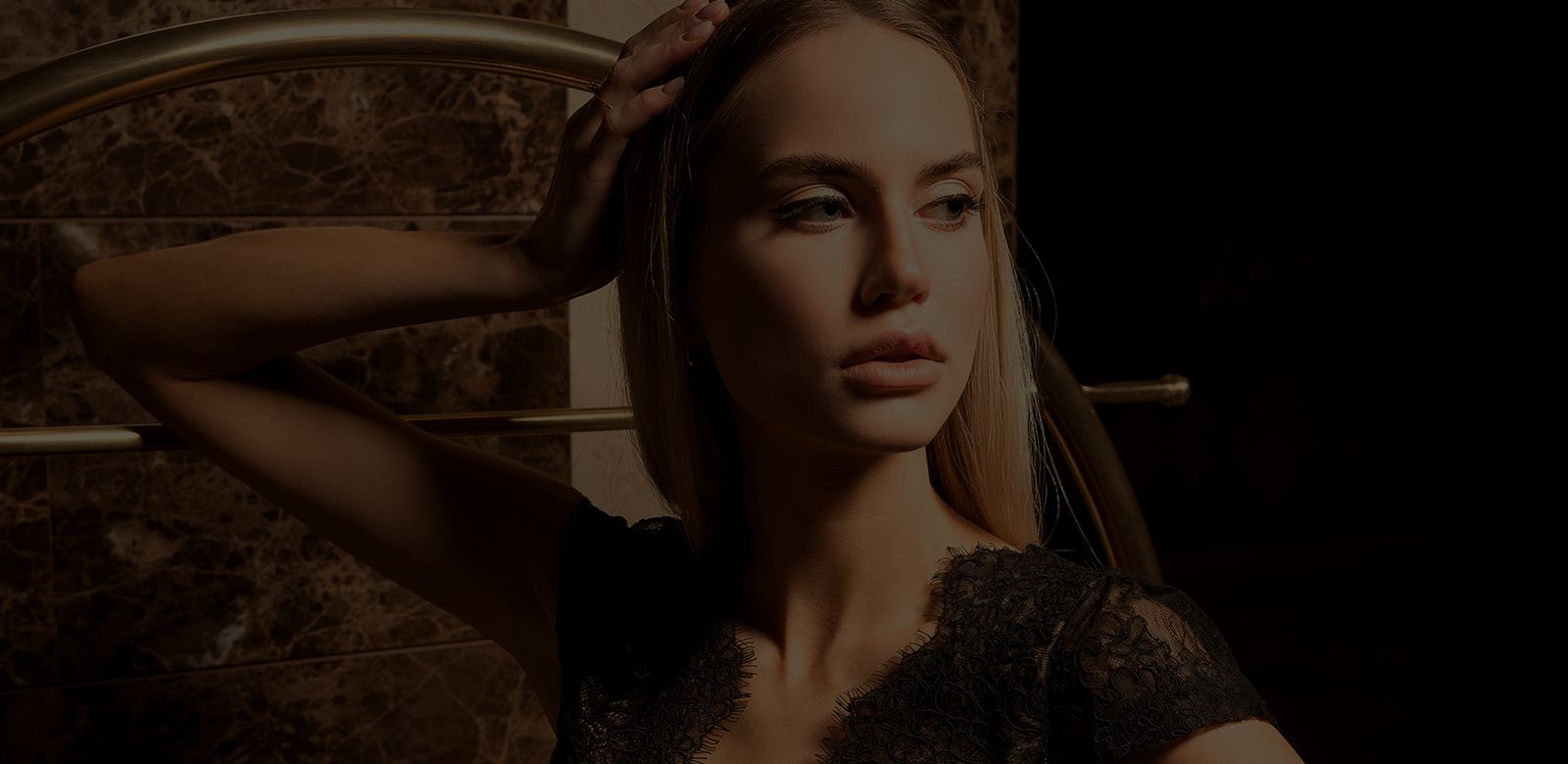 Woman with long hair in elegant pose.