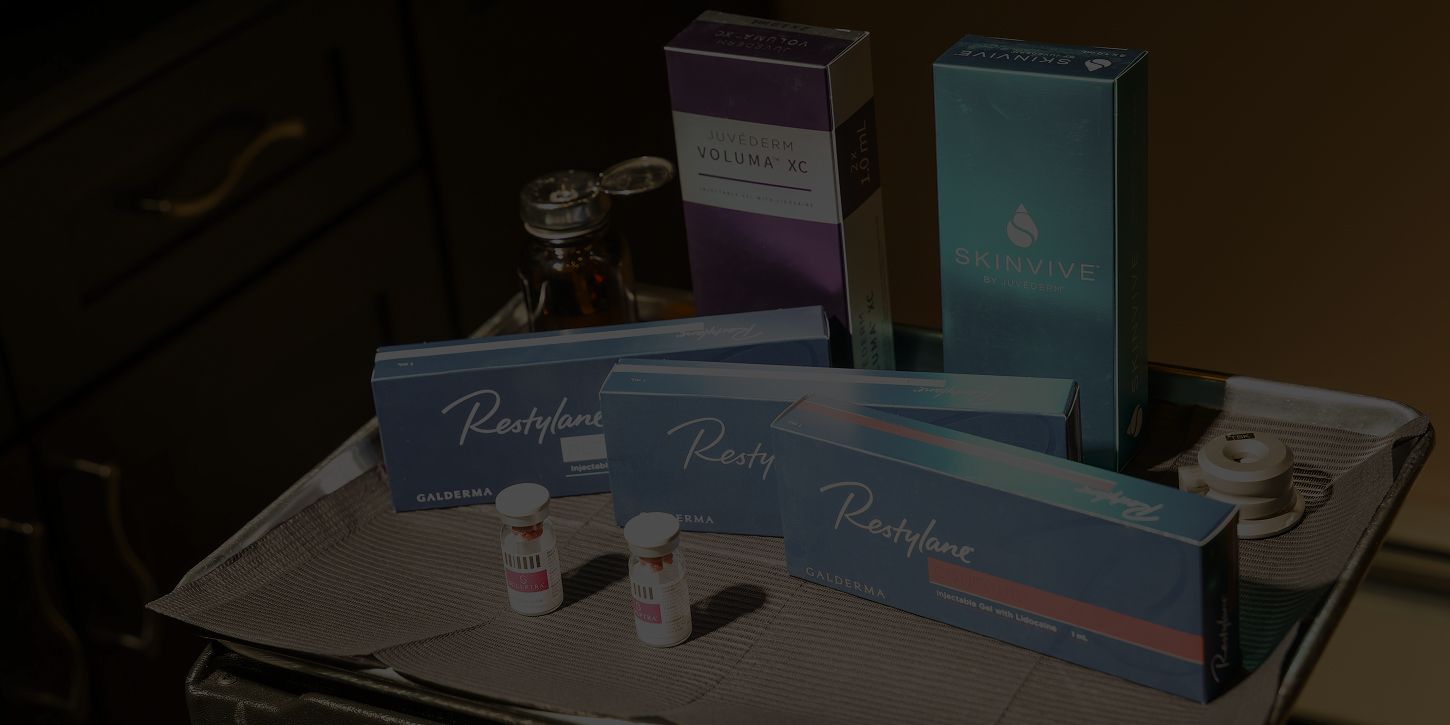 Injectable skincare products on a treatment tray.