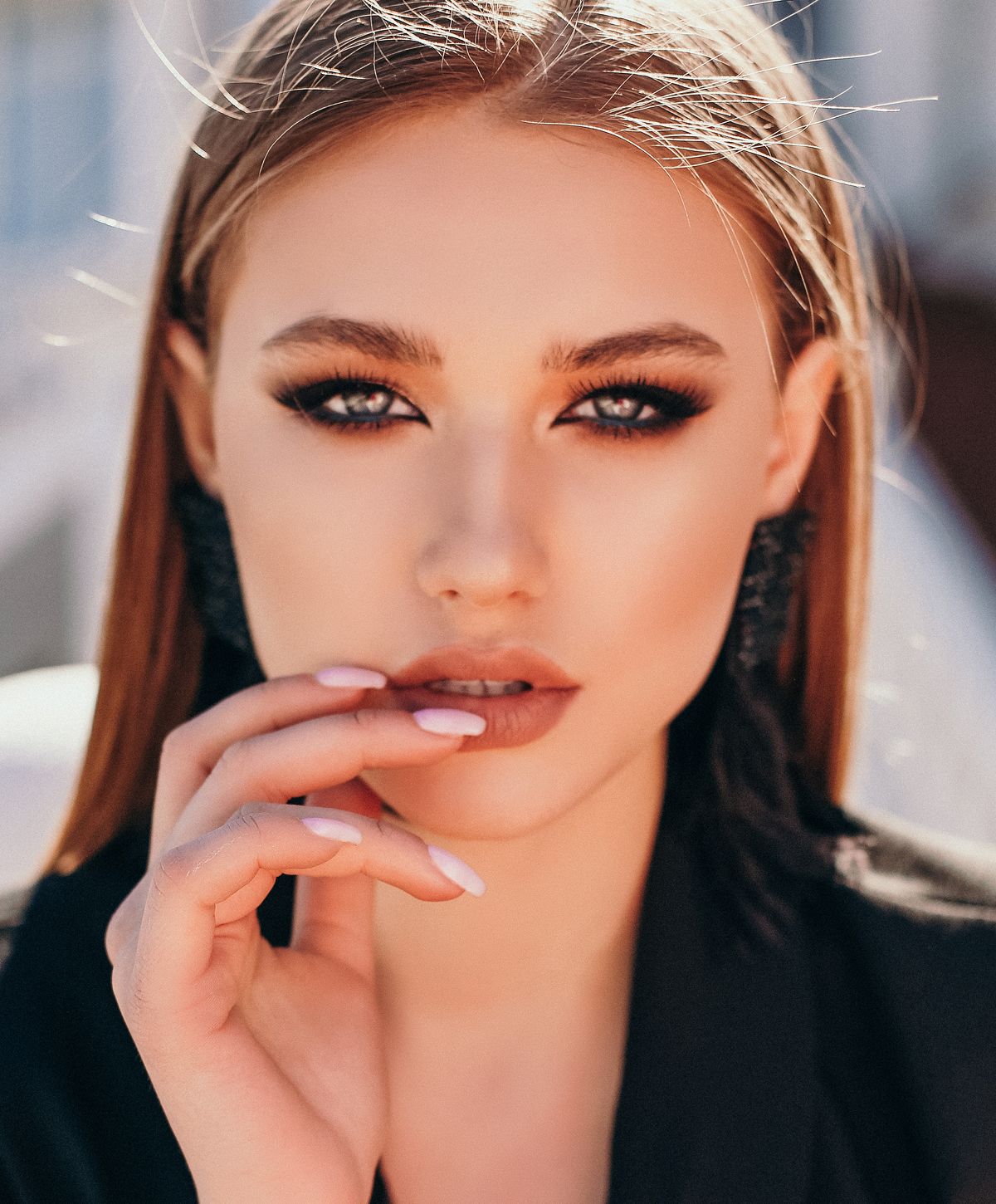 Portrait of a woman with striking makeup.