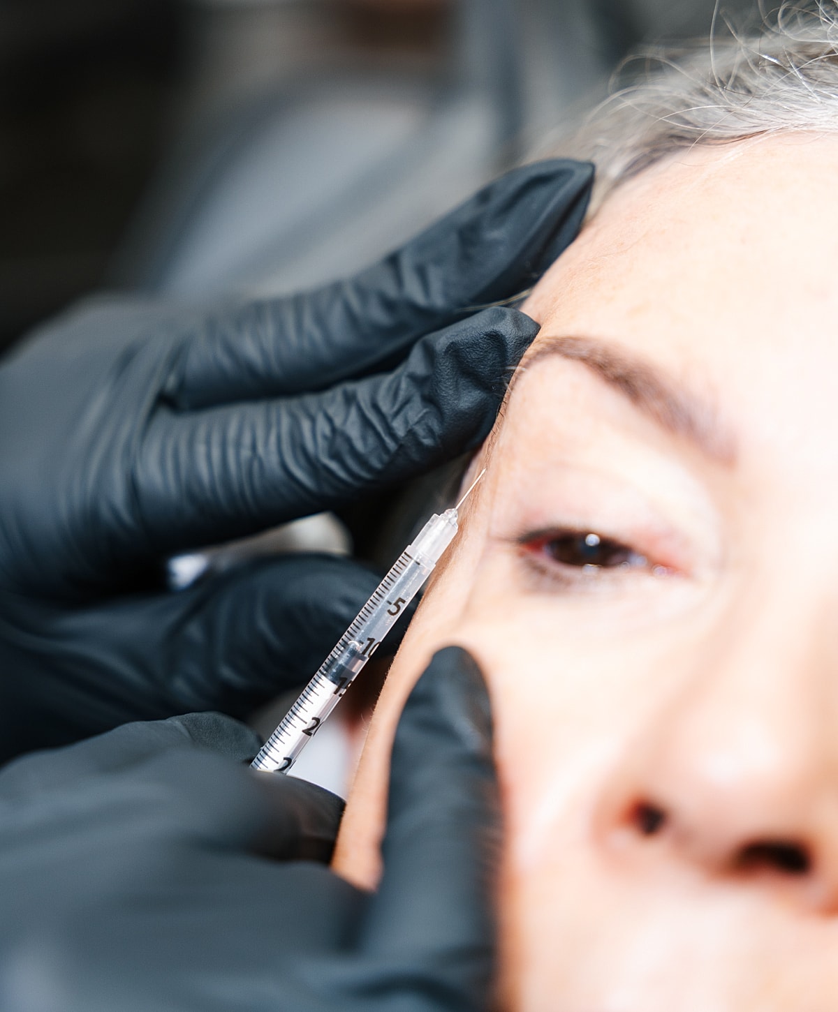 Administering Santa Fe Botox injection.