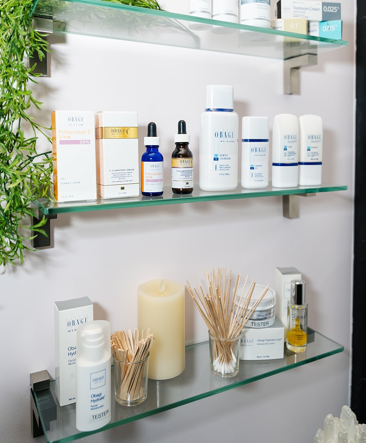 Skincare products displayed on glass shelves.