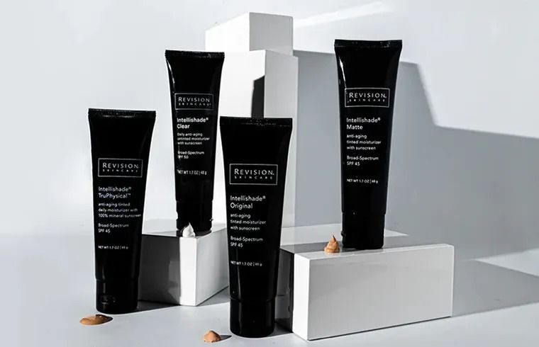Revision skincare products displayed on white background.