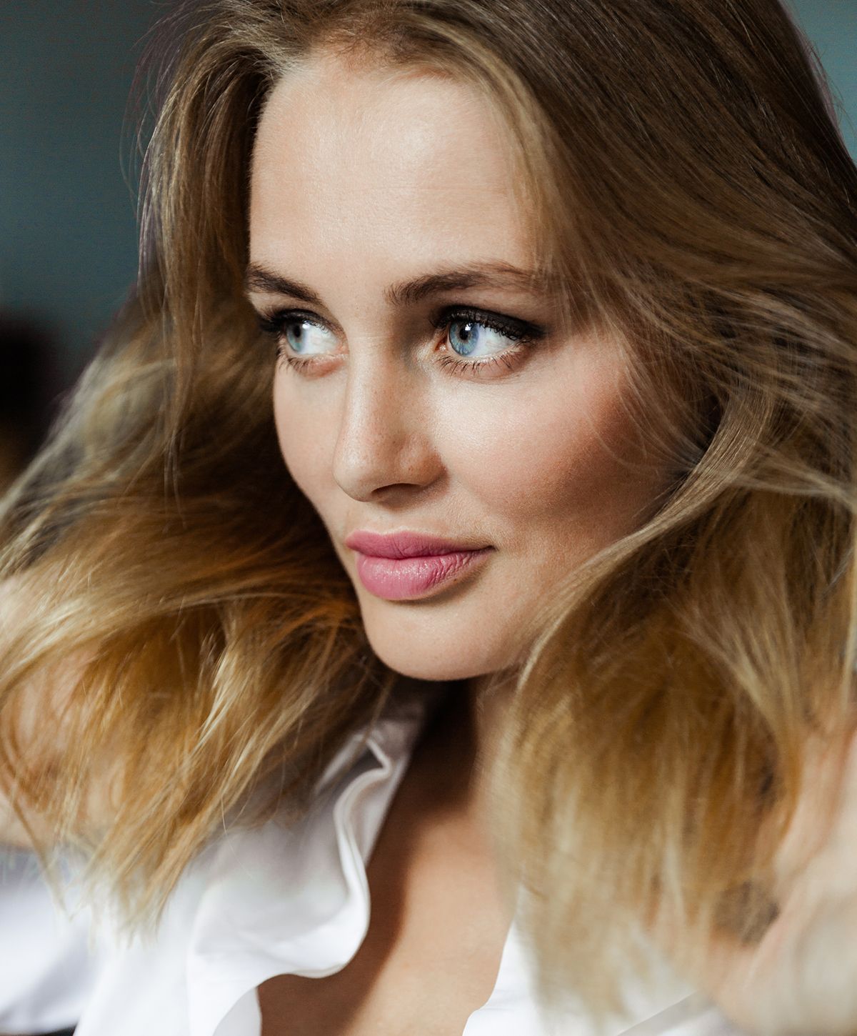 Close-up of a woman with flowing hair.