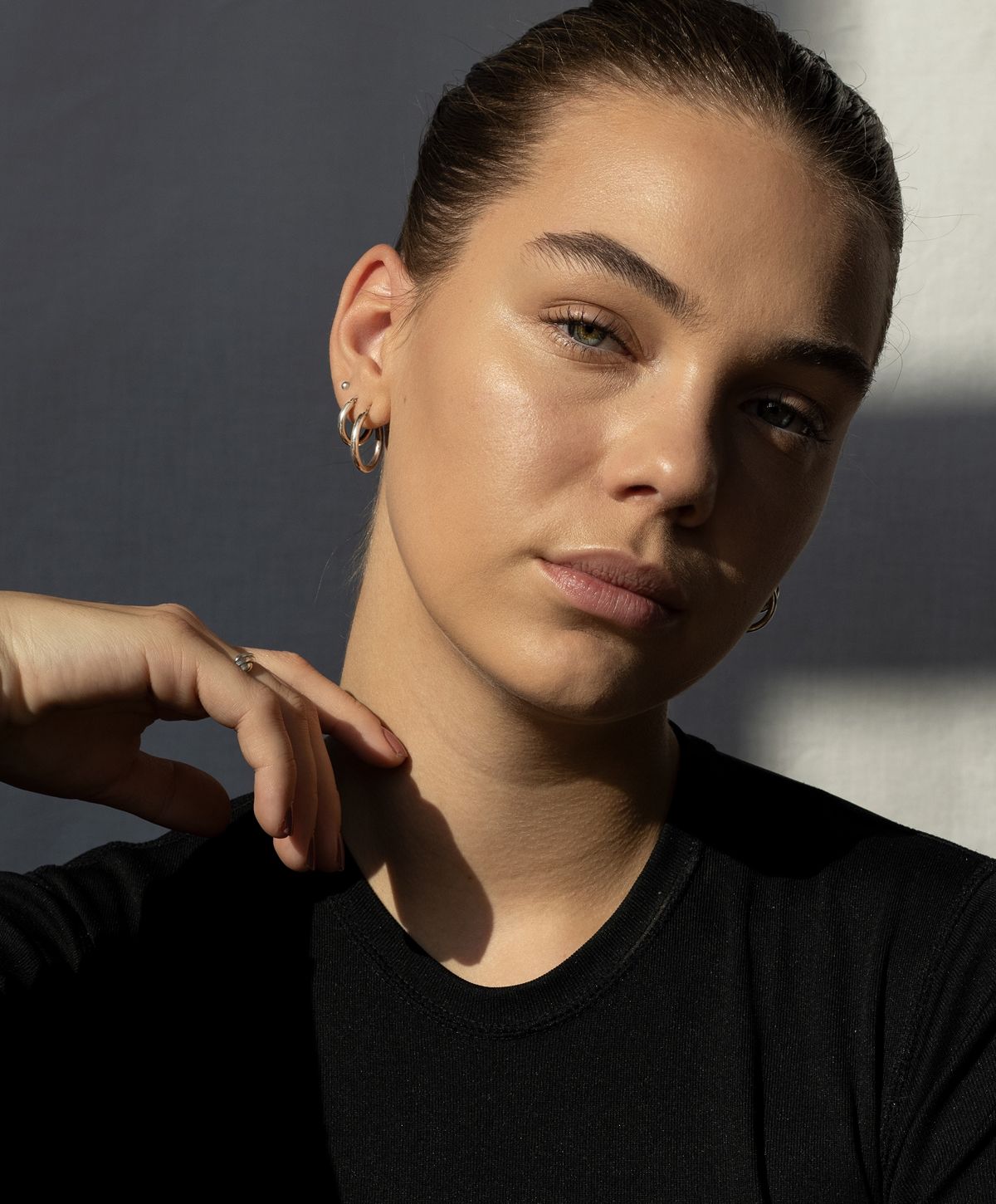 Portrait of a woman with subtle makeup and jewelry.