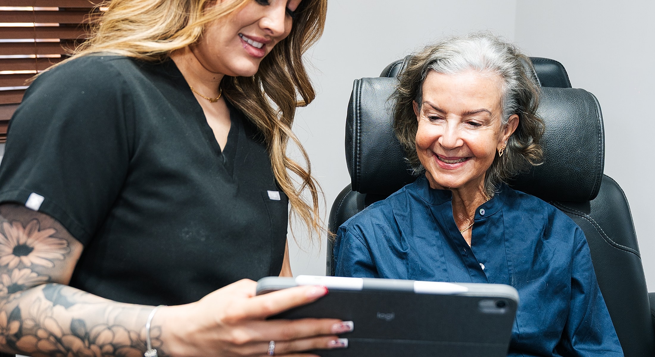 Patient and assistant reviewing information together.