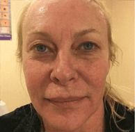 Close-up of a woman with blonde hair.